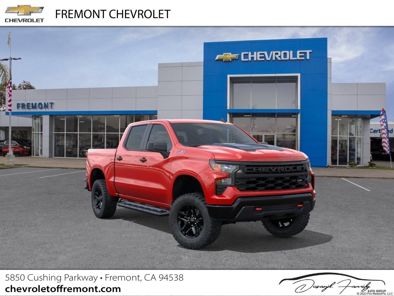 2026 Chevrolet Silverado 1500 Custom Trail Boss in Red Hot — front three-quarter view