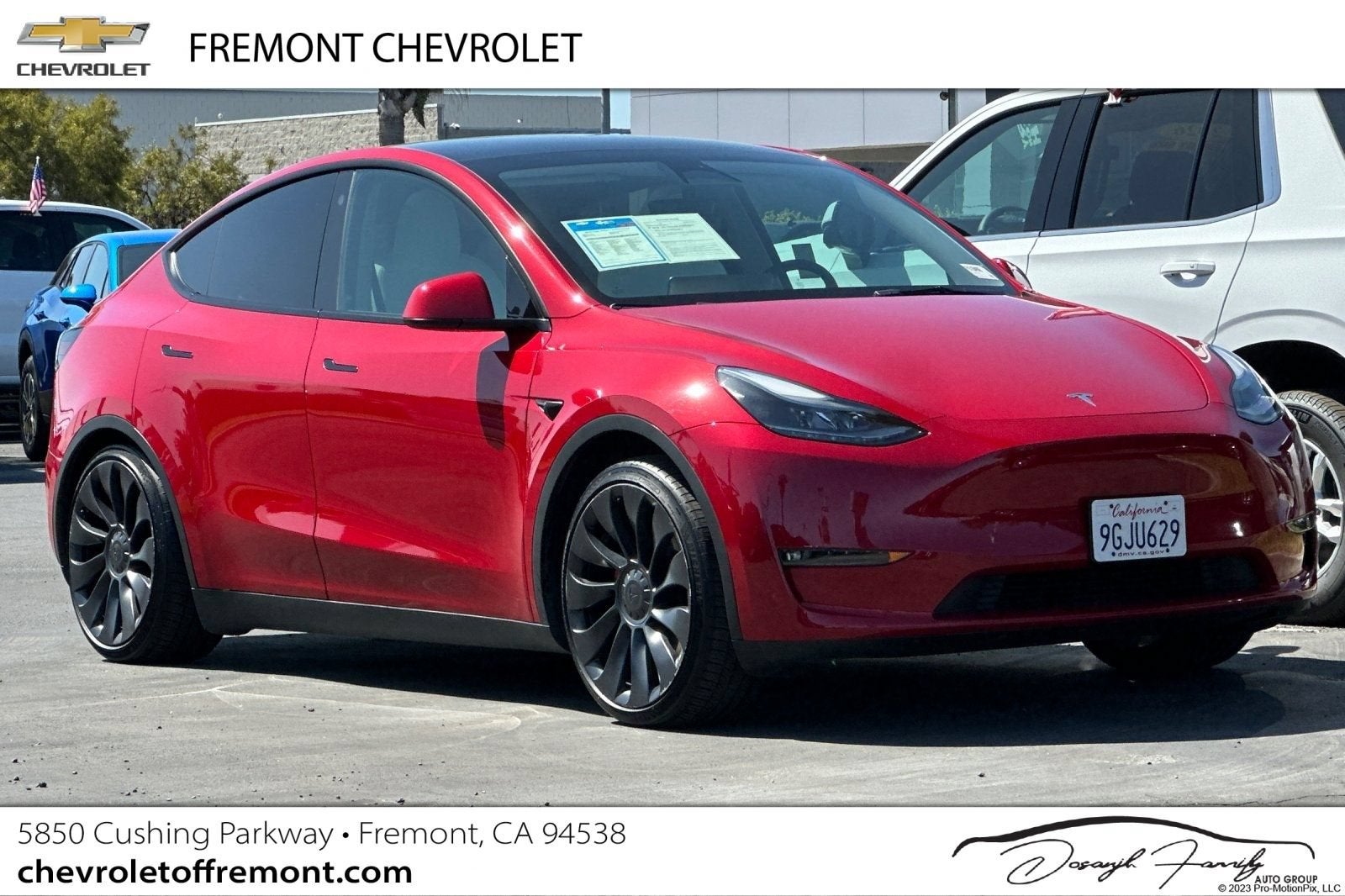 2023 Tesla Model Y Performance in Red — front three-quarter view