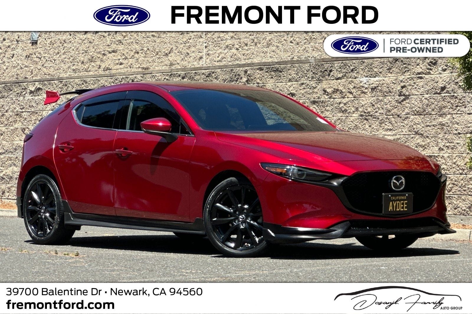 2021 Mazda Mazda3 Premium in Soul Red Crystal Metallic — front three-quarter view